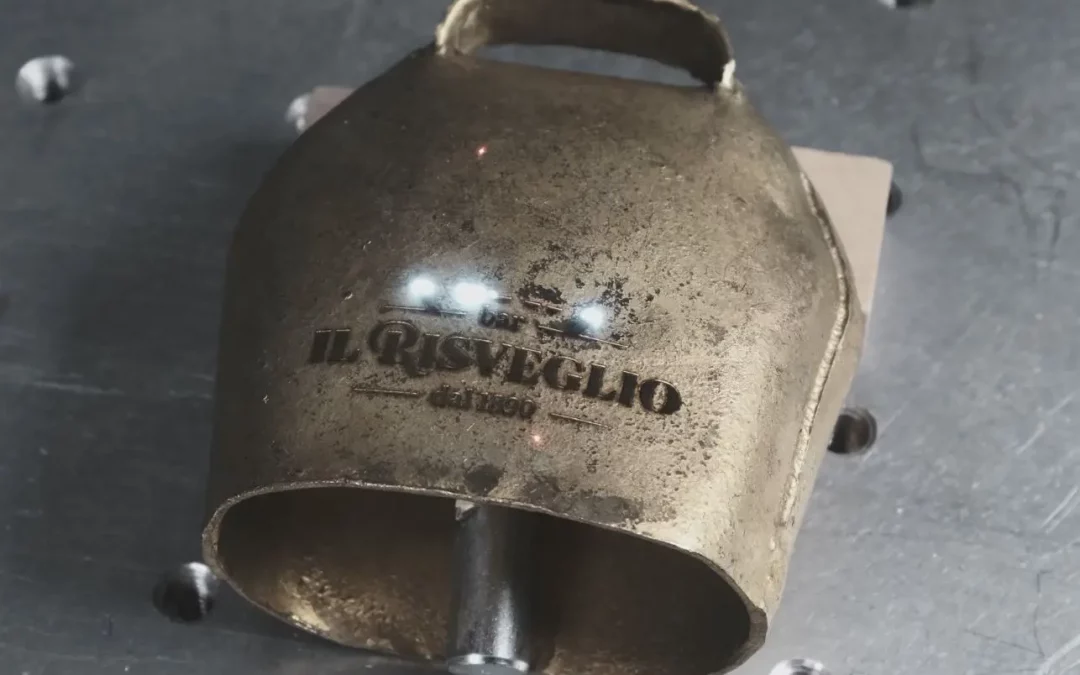 Laser marking of iron cowbells with brass plating